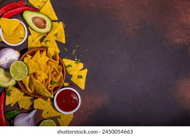 Traditional Mexican street food, fast food background, corn Taco, nachos with meat, vegetables, avocado, beans, corn, salsa. Served with various sauces. Mexican holiday flatlay