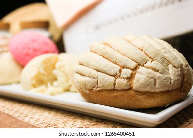 Traditional mexican sweet bread used for breakfast or dinner. Conchas with sugar top.