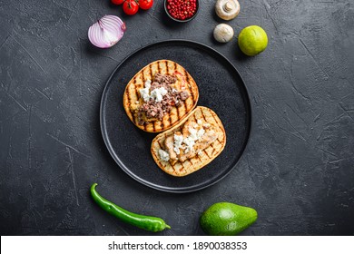 Traditional Mexican Taco With Chicken And Beef With Ingredients A Side On Black Plate Over Black Textured Background Top View