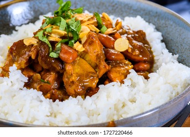 A traditional Moroccan dish called Chicken Tajine featuring Saffron, Honey, Almonds, Dates and Plain White Rice