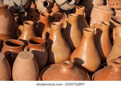 Traditional Moroccan raw orange pottery. Tajines, water pots. Close up photography. - Powered by Shutterstock