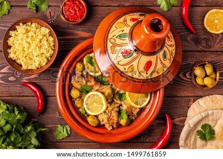 Traditional moroccan tajine of chicken with salted lemons, olives. Top view.