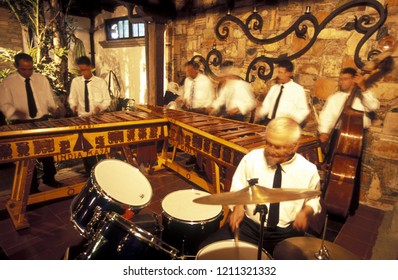 A Traditional Music Band Plays In A Restaurant In The Old City In The Town Of Antigua In Guatemala In Central America. 
Guatemala, Antigua, September, 2014