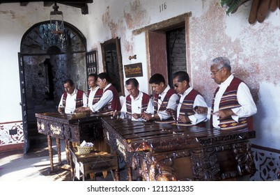 A Traditional Music Band Plays In A Restaurant In The Old City In The Town Of Antigua In Guatemala In Central America. 
Guatemala, Antigua, September, 2014