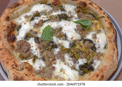 Traditional Neapolitan Pizza With Pork Sausage And Friarielli Broccoli Rabe.