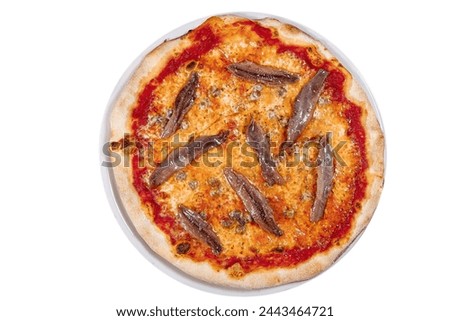 traditional neapolitan pizza with tomatoes anchovies capers and fresh basil from above and close up isolated on white wooden table