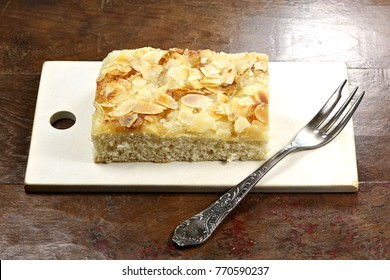 Traditional North German Butterkuchen (butter Cake) On Old Cutting Board. Butterkuchen Is A Favorite Element Of Westphalian And North German Coffee Tables.