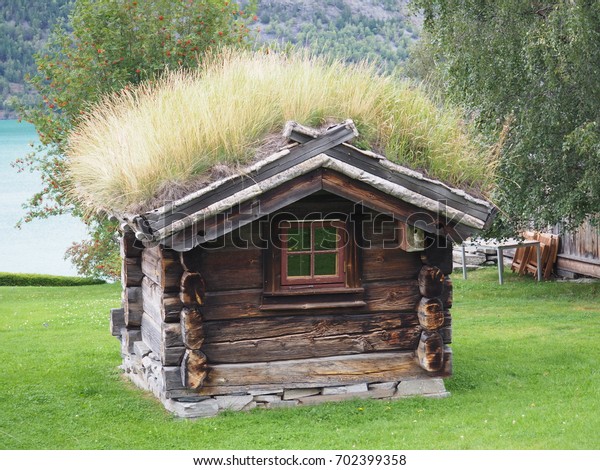 Traditional Norwegian Grass Covered Cabin Overlooking Stock Photo