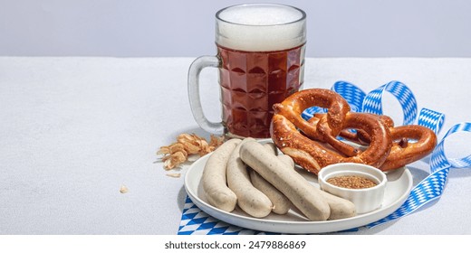 Traditional Oktoberfest set. Pretzels, beer, weisswurst with mustard. German festival food concept. Trendy hard light, dark shadow, light stone concrete background, banner format - Powered by Shutterstock