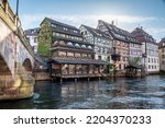 Traditional old alsatian houses and Pont st. Martin on a canal in Petit Venice (Small Venice) in Stasbourg in Alsace in the department of Haut-Rhin of the Grand Est region of France