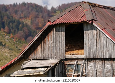 Traditional Old Architecture House Built In The Middle Of The Mountains From Romania. Beautiful Autumn Landscape On Rucar Bran Passage.