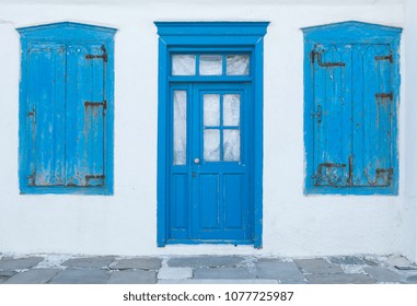 Traditional old greek house with blue door and windows - Powered by Shutterstock