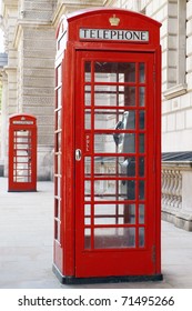 Traditional Old Style British Red Phone Boxes on a London Street