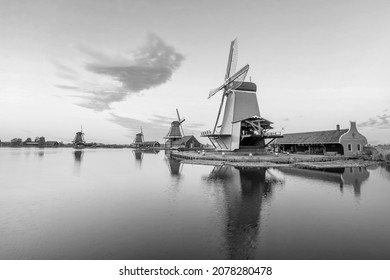 Traditional old village with dutch windmills in Amsterdam, Netherlands at sunset - Powered by Shutterstock