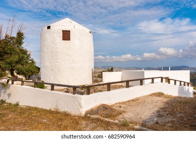 Traditional Old Windmill Located In Triovasalos Village On Milos Island. Cyclades, Greece.