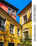 Traditional orange and yellow houses in the Plovdiv old town , Bulgaria