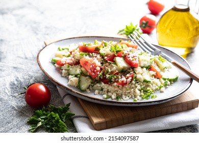 Traditional oriental salad Tabouleh. Tabule cous cous salad with vegetables. Tabbouleh with bulgur - Shutterstock ID 2154097587