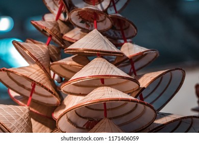 Traditional Oriental Straw And Bamboo Hats, Piled Up Ready For Packaging And Worldwide Shipping.