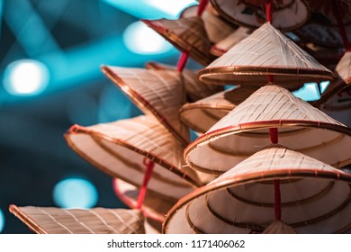 Traditional Oriental Straw And Bamboo Hats, Piled Up Ready For Packaging And Worldwide Shipping.