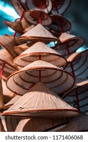 Traditional Oriental Straw And Bamboo Hats, Piled Up Ready For Packaging And Worldwide Shipping.