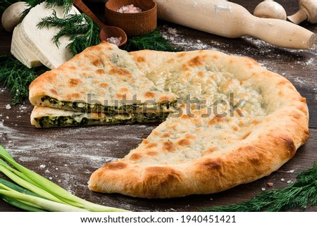 Traditional Ossetian feta cheese pie still life, ossetian pie with cheese Stock photo © 