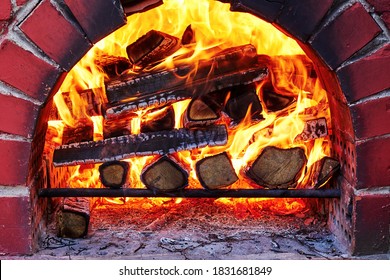 Traditional Outdoor Brick Oven With Burning Wood Inside. Cooking In The Country House