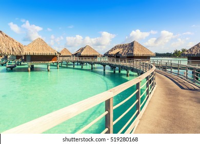 Traditional Over Water Villas On A Tropical Lagoon Of Bora Bora Island, Tahiti, French Polynesia