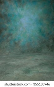 Traditional painted canvas or muslin fabric cloth studio backdrop or background, suitable for use with portraits, products and concepts. Shades of blue and green