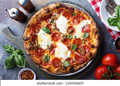Traditional Pepperoni Pizza With Mozarella And Basil Overhead View
