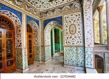 Traditional Persian design of the palace Golestan with painted walls, tiles and wooden doors, Tehran, Iran. The Golestan Palace belongs to royal buildings became the world heritage site of UNESCO