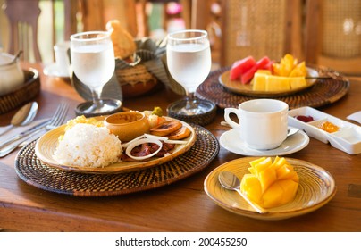 Traditional Philippino breakfast with garlic rice and adobo