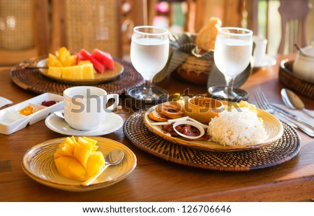 Traditional Philippino breakfast with garlic rice and adobo