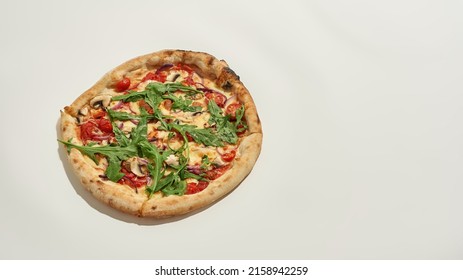 Traditional Pizza From Tomato, Cheese, Mushroom And Greens On White Background. Unhealthy Eating And Fast Food. Fresh Baked High-calorie Delicious And Appetizing Junk Food. Studio Shoot. Copy Space