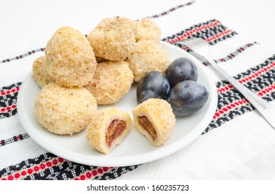 Traditional Plum Dumplings With Prunes On A Traditional Romanian Table Cloth