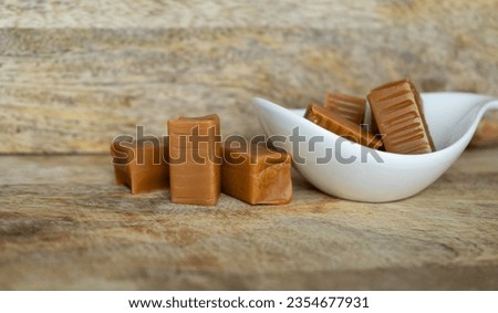 Traditional Polish fudge, known as Krówki meaning little cows. Krówka milky cream toffee candies from Poland. Creamy milk fudge, sweet confectionery candy.