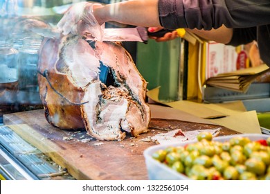 The Traditional Pork Of Ariccia On The Counter Of A Street Vendor (italian Food). A Woman Slices The Pork To Make A Sandwich. Frascati, Ariccia, Rome, Lazio, Italy, Roman Castles