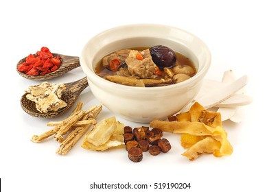 Traditional Pork Rips Clear Soup With Chinese Herbs Medicine On White Background Surround With Dry Herbals.