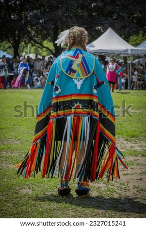 Traditional Pow Wow dance festival. Open free dancing, drumming and performances event in Fort York - culture first nations, traditional woman dance.Toronto, Ontario, Canada