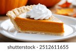 Traditional pumpkin pie topped with whipped cream