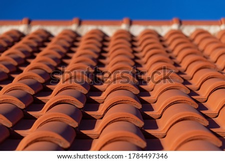 Traditional red clay roof tiles in Krk Croatia, harbour town and touristical destination on an adriatic island on a sunny summer day