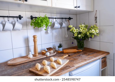 traditional retro kitchen interior, Unbaked raw homemade flaky croissants on wooden board, prepared for oven, homemade pastry, baking preparation - Powered by Shutterstock