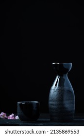 Traditional rice sake serwing tableware on dark background.