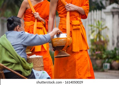 Traditional Ritual Of Alms Giving In Luang Prabang, Laos.