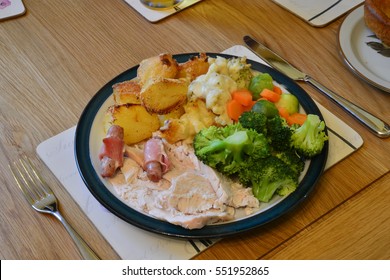 A Traditional Roast Chicken Dinner In The UK.