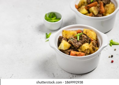 Traditional roast and potatoes in pots. Copy space.