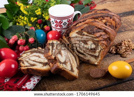 Traditional Romanian Easter table with cozonac and pasca meaning Sweetbread and Matzo an unleavened flatbread that is part of Jewish cuisine and forms an integral element of the Passover. Happy Easter
