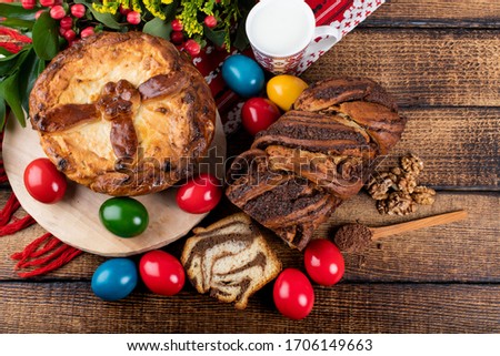 Traditional Romanian Easter table with cozonac and pasca meaning Sweetbread and Matzo an unleavened flatbread that is part of Jewish cuisine and forms an integral element of the Passover. Happy Easter