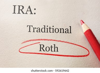 Traditional And Roth IRA Circled In Red Pencil -- Retirement Concept                              