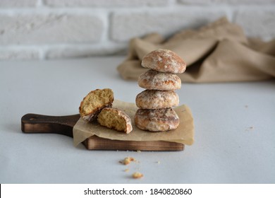 Traditional Russian Gingerbread Cookies Stacked On Wooden Board. Pryanik Or Honey Cake In Gkazer.