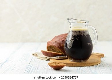Traditional russian summer drink, kvass on wooden background. Space for text.